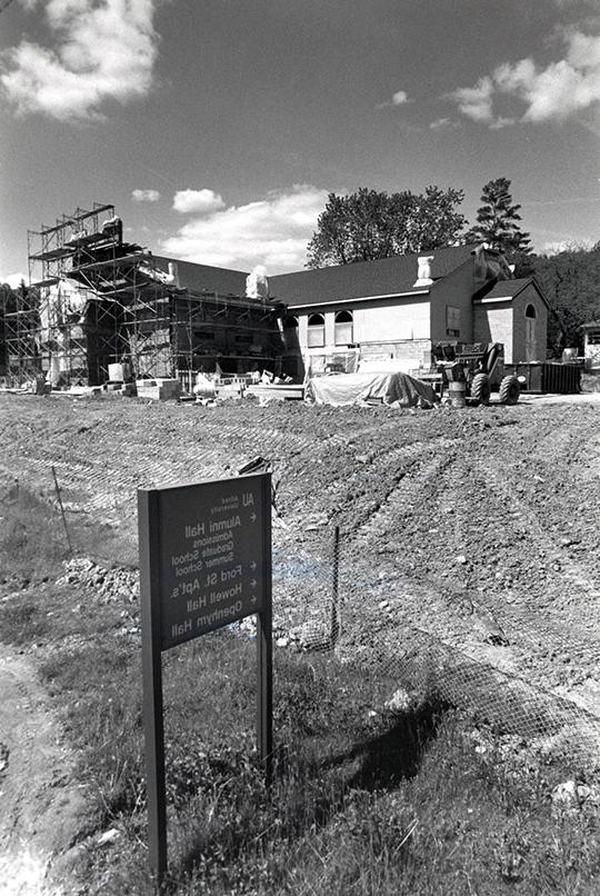 black and white photo of building under construction